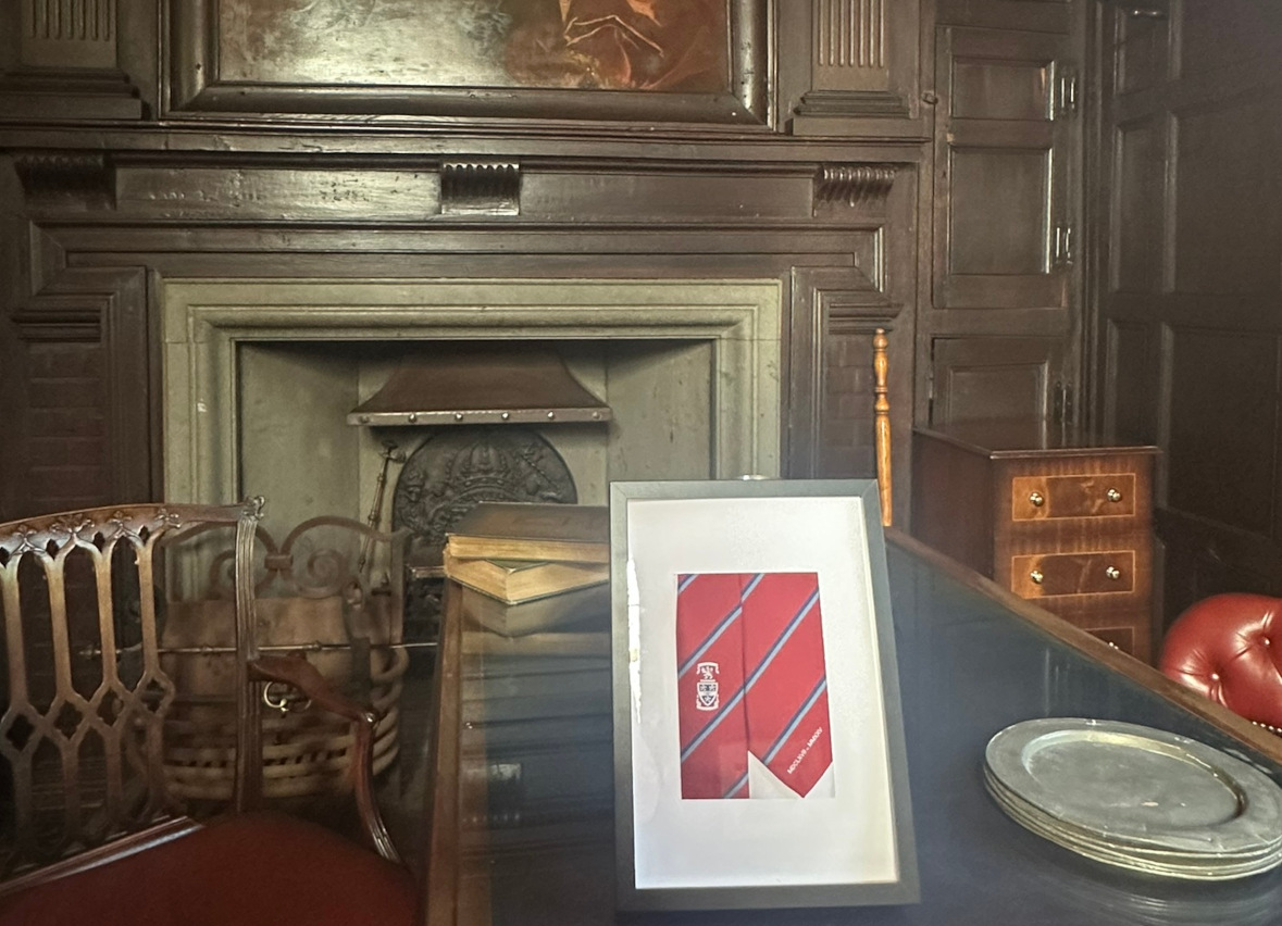 Oak Room office with portrait of OSH Founder Thomas Foley in the background and framed commemorative Year 11 tie in the foreground