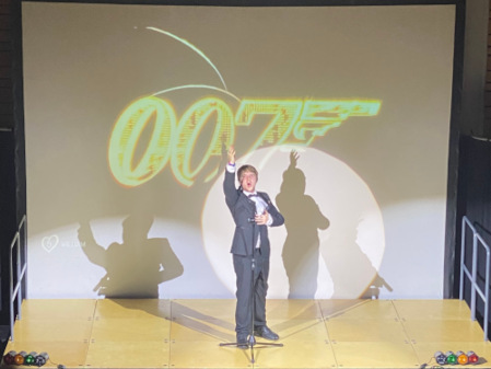 Bond..Will Bond performs with a dramatic James Bond themed background