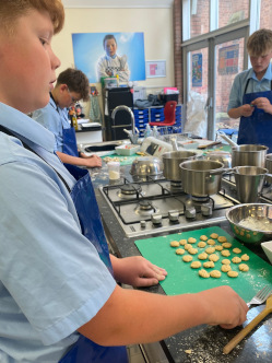 Students getting stuck in making pasta