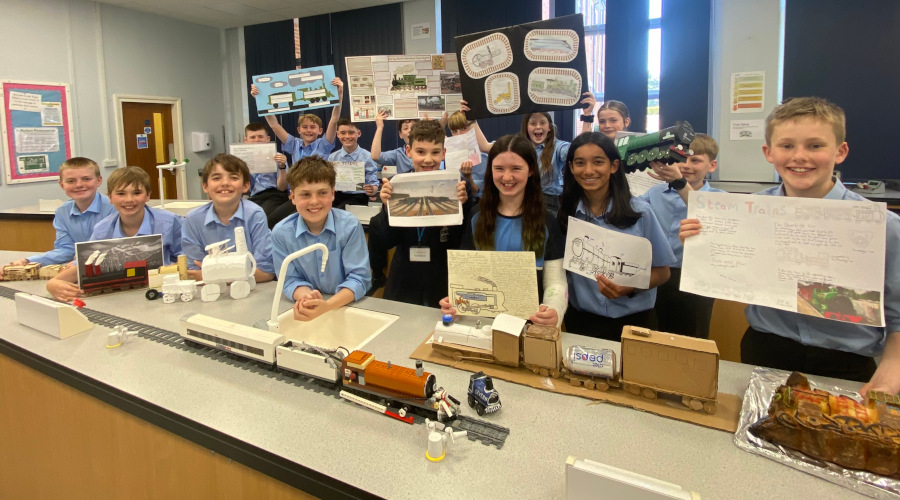 Students with their rail-related competition entries