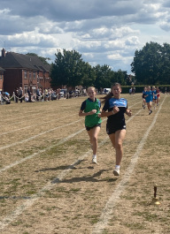 Long distance junior girls reach their penultimate lap