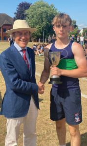 Freddie collects his Intermediate Victrix Ludorum trophy