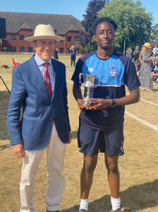 Theo collects the Relay Trophy on behalf of Potter House