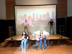 Four Year 7 girls sing, dance and play guitar