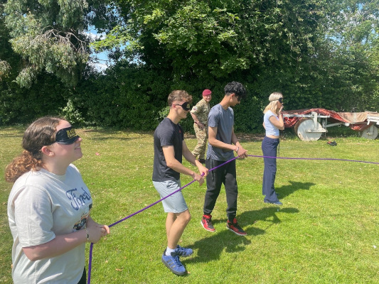 Prefects on teambuilding exercises trying blind-folded rope challenges